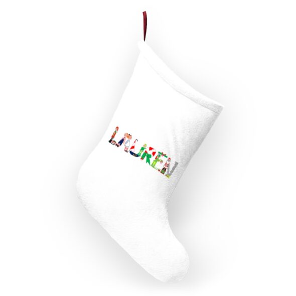 White stocking with text ‘Lauren’ in colourful Christmas themed lettering, with red hanging loop