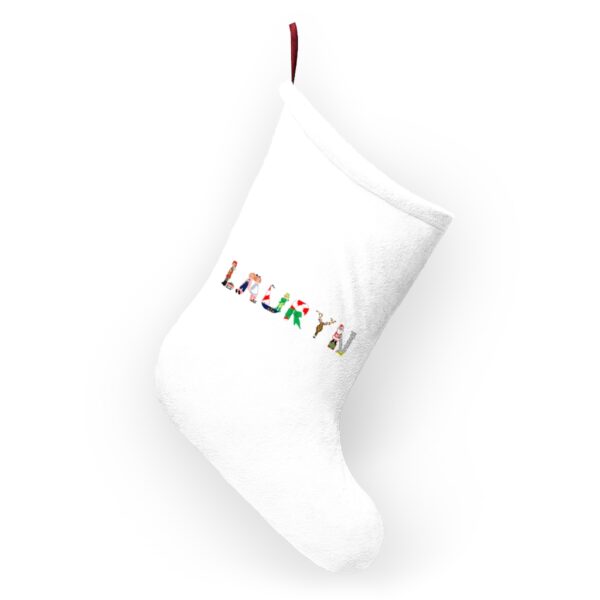 White stocking with text ‘Lauryn’ in colourful Christmas themed lettering, with red hanging loop