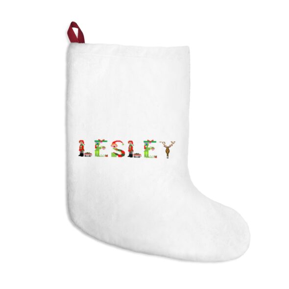 White stocking with text ‘Lesley’ in colourful Christmas themed lettering, with red hanging loop