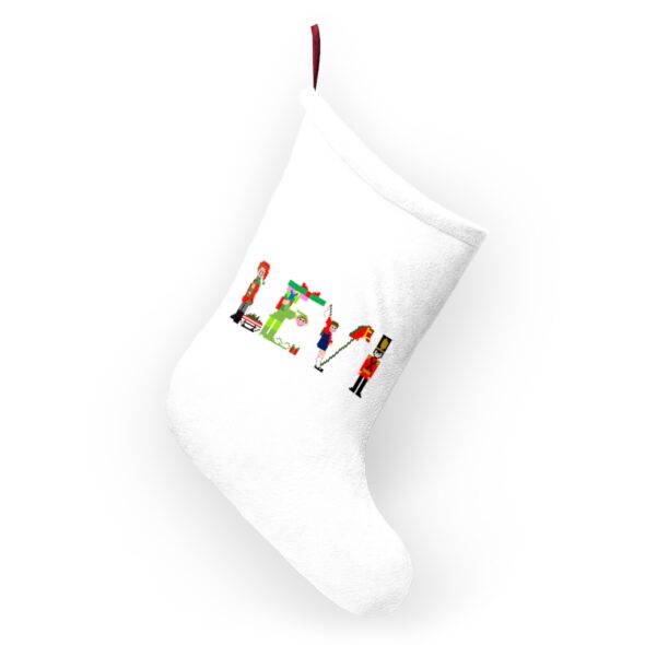 White stocking with text ‘Levi’ in colourful Christmas themed lettering, with red hanging loop