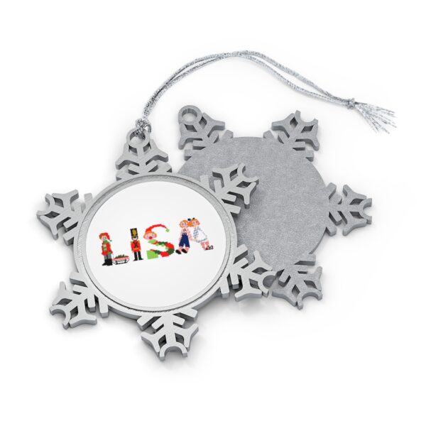 Silver-toned snowflake ornament with white insert with text ‘Lisa’ in colourful Christmas themed lettering, with silver hanging loop
