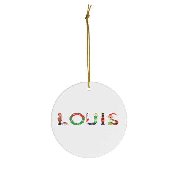 White ceramic ornament with text ‘Louis’ in colourful Christmas themed lettering, with gold hanging loop