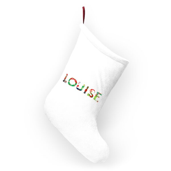 White stocking with text ‘Louise’ in colourful Christmas themed lettering, with red hanging loop