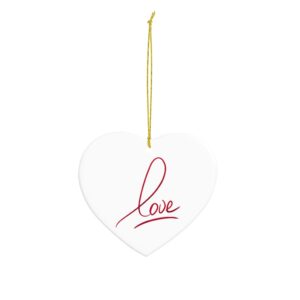 White heart shaped ceramic ornament, featuring the word love in a red script print