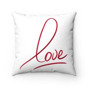 White faux suede cushion, featuring the word love in a red script print