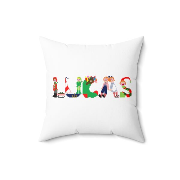 White faux suede cushion with text ‘Lucas’ in colourful Christmas themed lettering