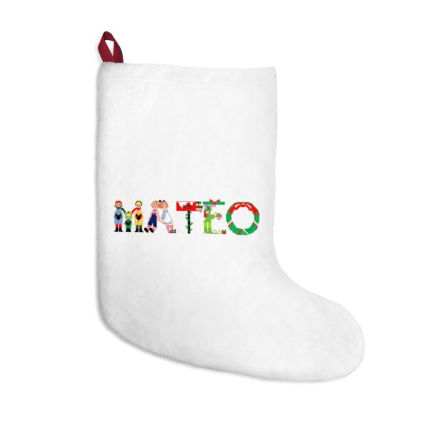 White stocking with text ‘Mateo’ in colourful Christmas themed lettering, with red hanging loop