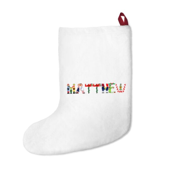 White stocking with text ‘Matthew’ in colourful Christmas themed lettering, with red hanging loop