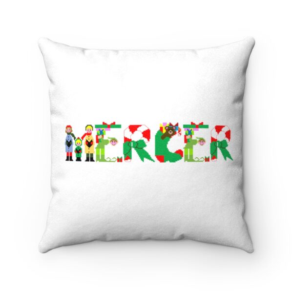 White faux suede cushion with text ‘Mercer’ in colourful Christmas themed lettering