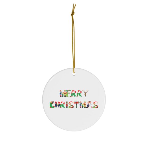 White ceramic ornament with text ‘Merry Christmas’ in colourful Christmas themed lettering, with gold hanging loop