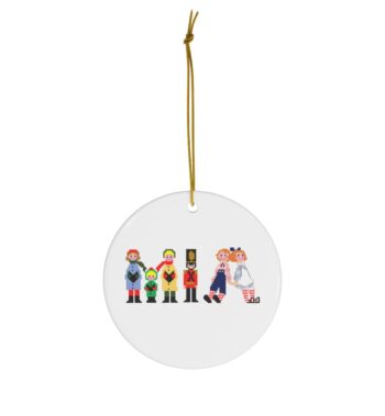 White ceramic ornament with text ‘Mia’ in colourful Christmas themed lettering, with gold hanging loop