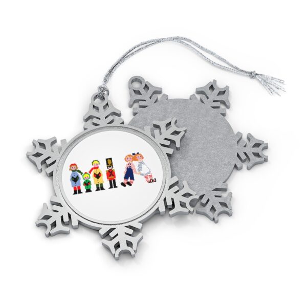 Silver-toned snowflake ornament with white insert with text ‘Mia’ in colourful Christmas themed lettering, with silver hanging loop