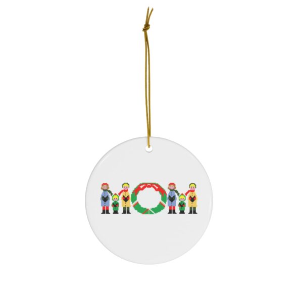 White ceramic ornament with text ‘Mom’ in colourful Christmas themed lettering, with gold hanging loop
