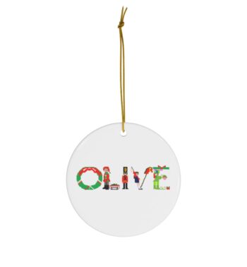 White ceramic ornament with text ‘Olive’ in colourful Christmas themed lettering, with gold hanging loop