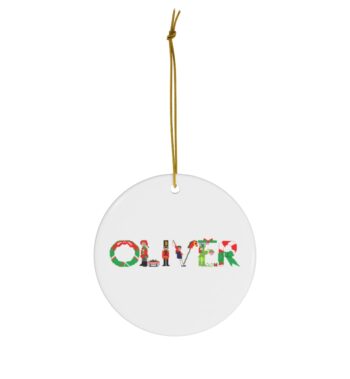 White ceramic ornament with text ‘Oliver’ in colourful Christmas themed lettering, with gold hanging loop