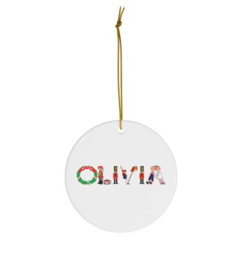 White ceramic ornament with text ‘Olivia’ in colourful Christmas themed lettering, with gold hanging loop