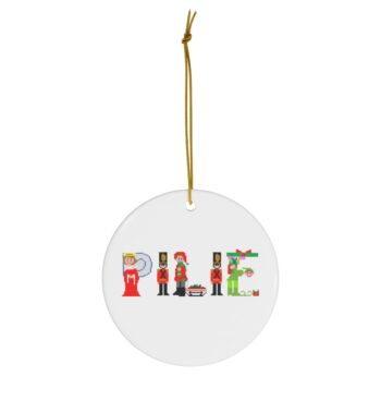 White ceramic ornament with text ‘Pilie’ in colourful Christmas themed lettering, with gold hanging loop