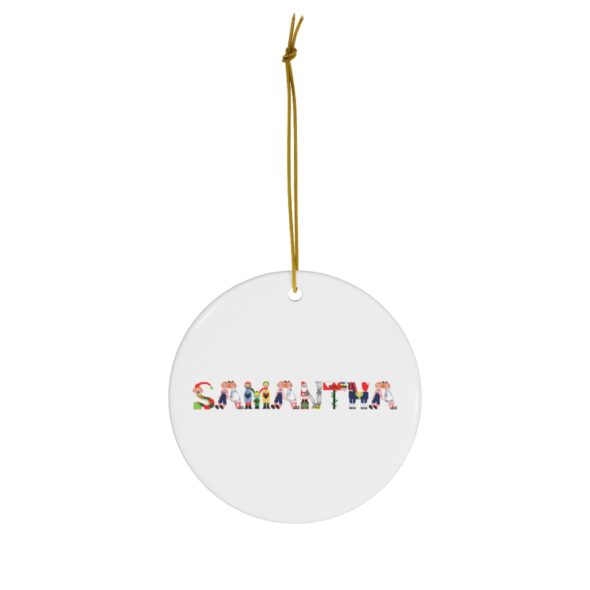 White ceramic ornament with text ‘Samantha’ in colourful Christmas themed lettering, with gold hanging loop