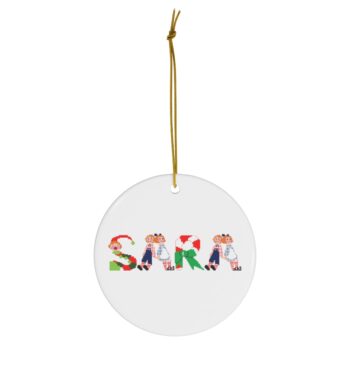 White ceramic ornament with text ‘Sara’ in colourful Christmas themed lettering, with gold hanging loop