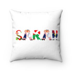 White faux suede cushion with text ‘Sarah’ in colourful Christmas themed lettering