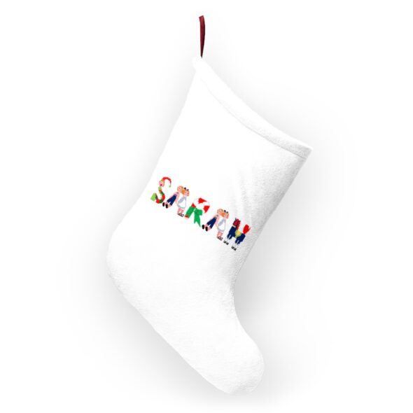 White stocking with text ‘Sarah’ in colourful Christmas themed lettering, with red hanging loop