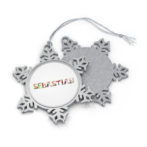 Silver-toned snowflake ornament with white insert with text ‘Sebastian’ in colourful Christmas themed lettering, with silver hanging loop