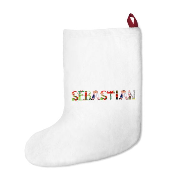 White stocking with text ‘Sebastian’ in colourful Christmas themed lettering, with red hanging loop