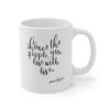 White 11 ounce mug, featuring the lyric ‘Shower the people you love with love’ in the shape of a heart