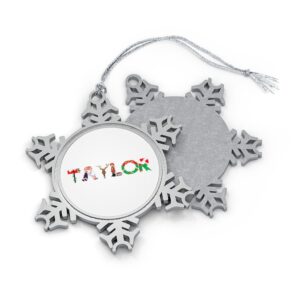Silver-toned snowflake ornament with white insert with text ‘Taylor’ in colourful Christmas themed lettering, with silver hanging loop