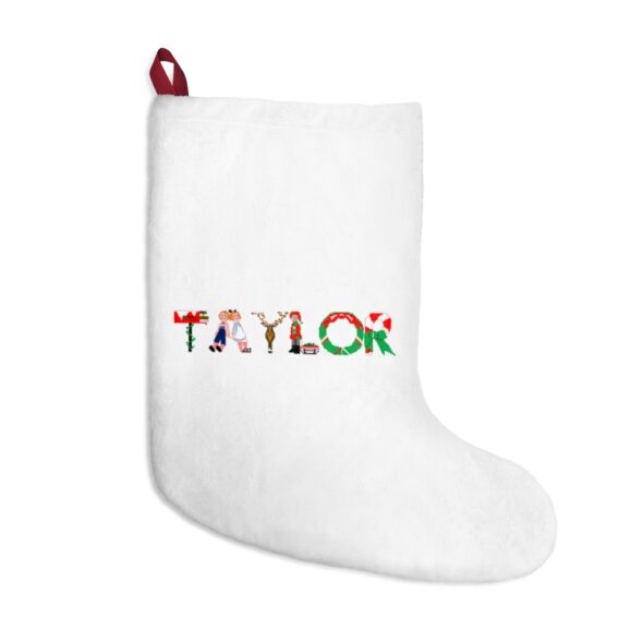 White stocking with text ‘Taylor’ in colourful Christmas themed lettering, with red hanging loop