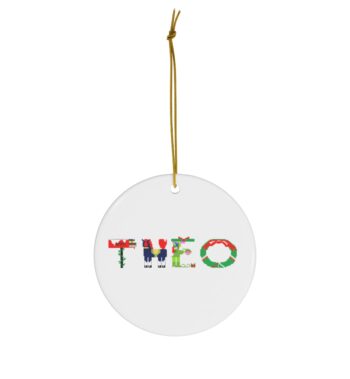 White ceramic ornament with text ‘Theo’ in colourful Christmas themed lettering, with gold hanging loop