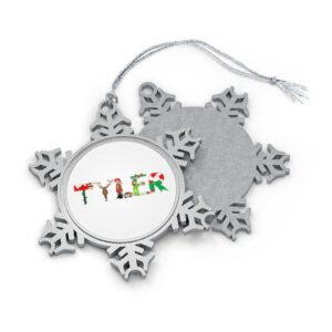 Silver-toned snowflake ornament with white insert with text ‘Tyler’ in colourful Christmas themed lettering, with silver hanging loop