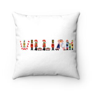 White faux suede cushion with text ‘William’ in colourful Christmas themed lettering